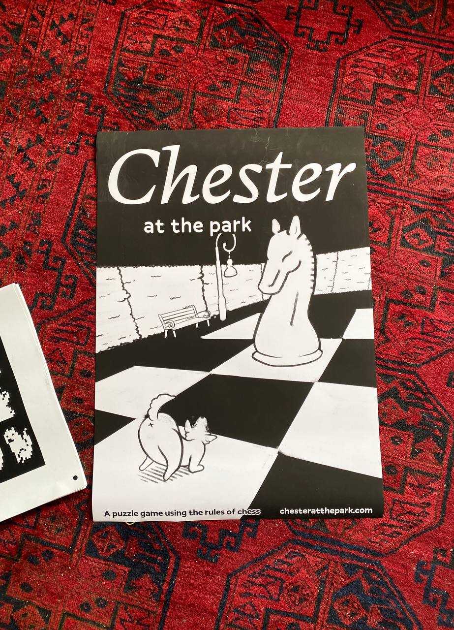 A poster for Chester, lying on a red rug